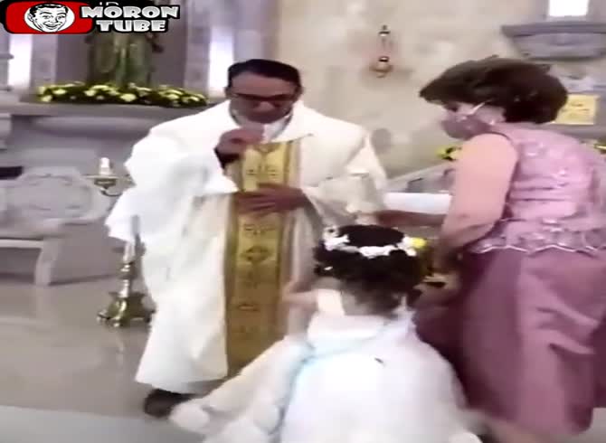 Video :A youngster offers a priest a high five, but she has no idea what he's doing!